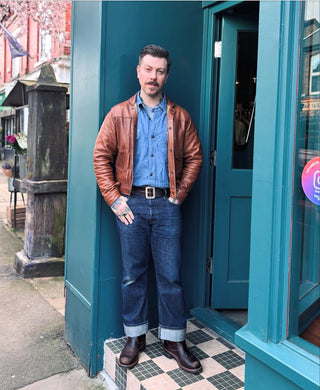 Alex. owner of Auteur store standing outside the shop door