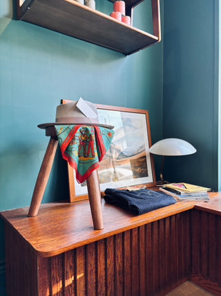 detailed shot of store with hat and scarf sitting on a small stool